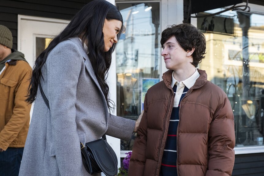 Kate Hawthorne (Meredith Garretson) caresses Max Hawthorne's (Judah Prehn) arm on Resident Alien Episode 404.