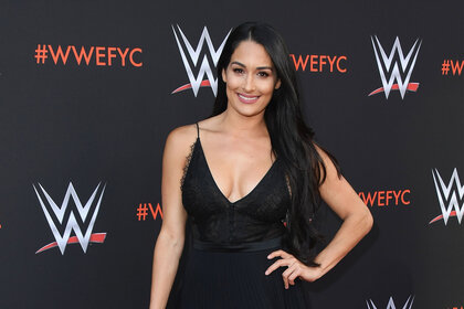 Nikki Bella walking a red carpet