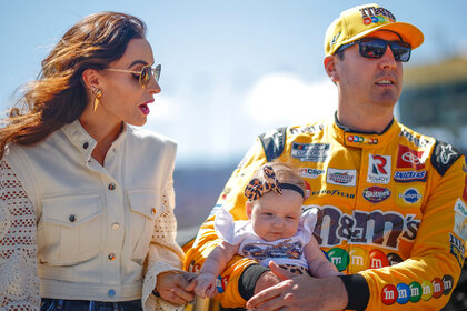 Kyle Busch holding his daughter