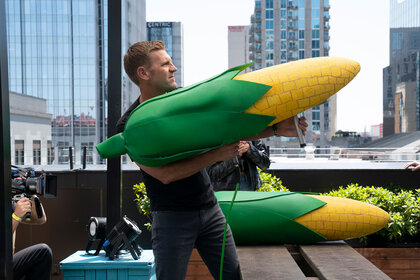 Barmageddon contestant playing air-cannon cornhole