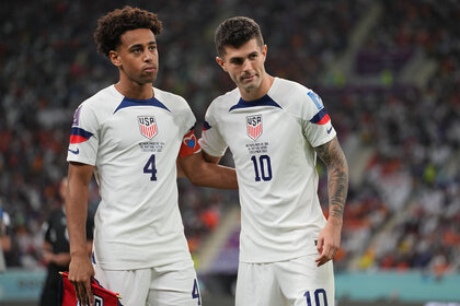 Tyler Adams #4 and Christian Pulisic #10 of the United States during a FIFA World Cup Qatar 2022 Round of 16 match