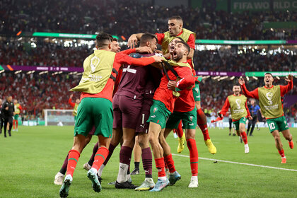 Morocco players celebrates after the team's victory in the penalty shoot out during the FIFA World Cup Qatar 2022 Round of 16 match between Morocco and Spain