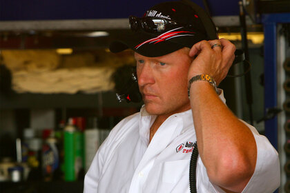 Tommy Baldwin listening to his radio during a race