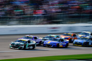 Brad Keselowski, Denny Hamlin, Erik Jones, Tyler Reddick, Ryan Blaney, Kevin Harvick, and Chase Elliott race during the NASCAR Cup Series Hollywood Casino 400