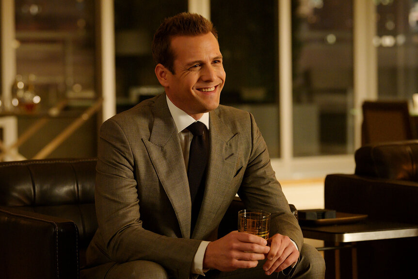 Harvey Spector (Gabriel Macht) smiles in a scene for Suits