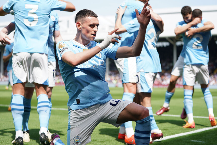 Phil Foden celebrates scoring a goal during the match between Fulham FC and Manchester City