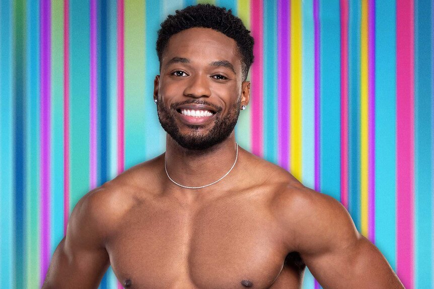 Hakeem from Love Island USA Season 6 shirtless in front of a striped background