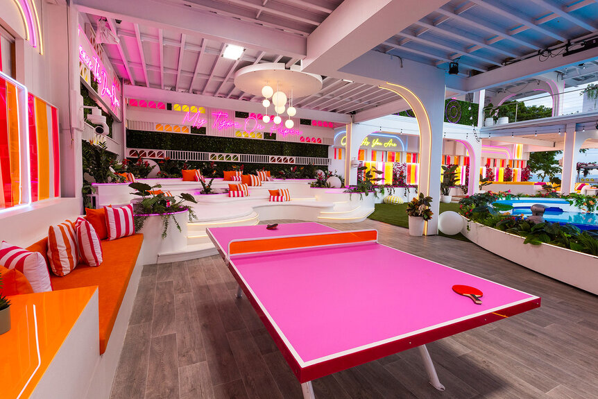 Exterior shot of the Love Island Villa that features a pink ping pong table