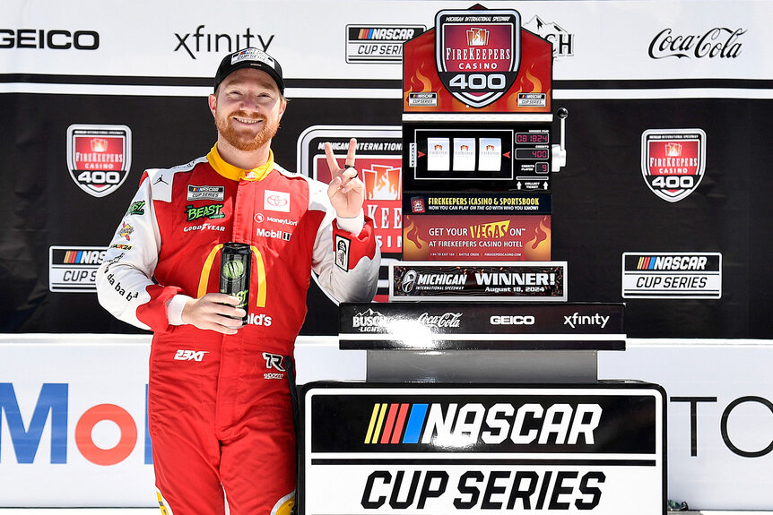 Tyler Reddick celebrates in victory lane after winning the NASCAR Cup Series FireKeepers Casino 400