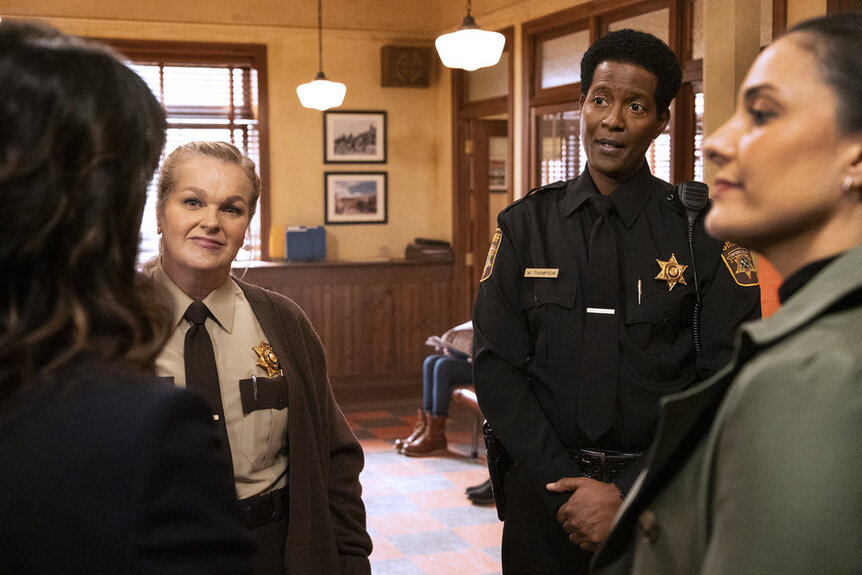 Deputy Liv Baker (Elizabeth Bowen), Sheriff Mike Thompson (Corey Reynolds), and Detective Lena Torres (Nicola Correia-Damude) during Resident Alien